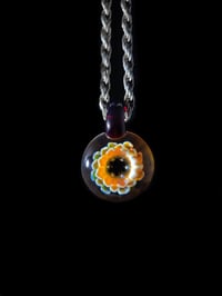 Image 1 of Psychedelic flower pendant with amber purple loop.