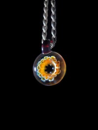 Image 2 of Psychedelic flower pendant with amber purple loop.