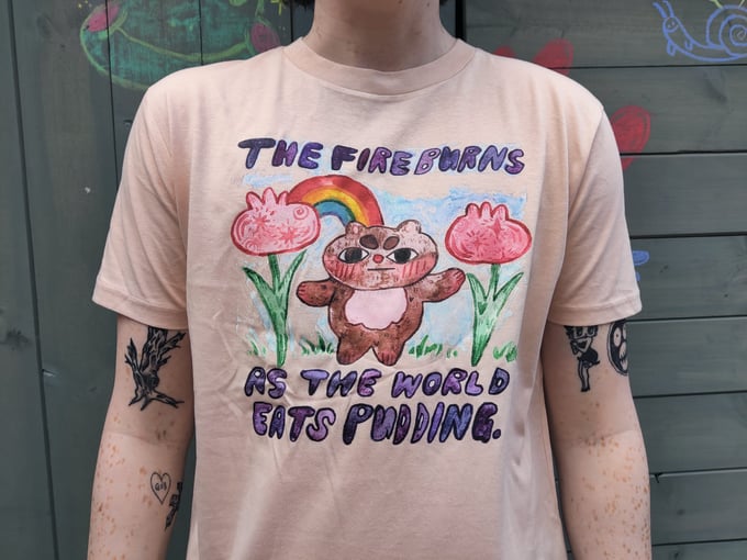 Image of 'The Fire Burns As The World Eats Pudding' t-shirt by Ara Carmona