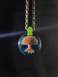 Image 1 of Psychedelic tree pendant backed in blue stardust