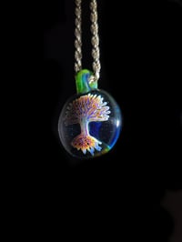 Image 2 of Psychedelic tree pendant backed in blue stardust