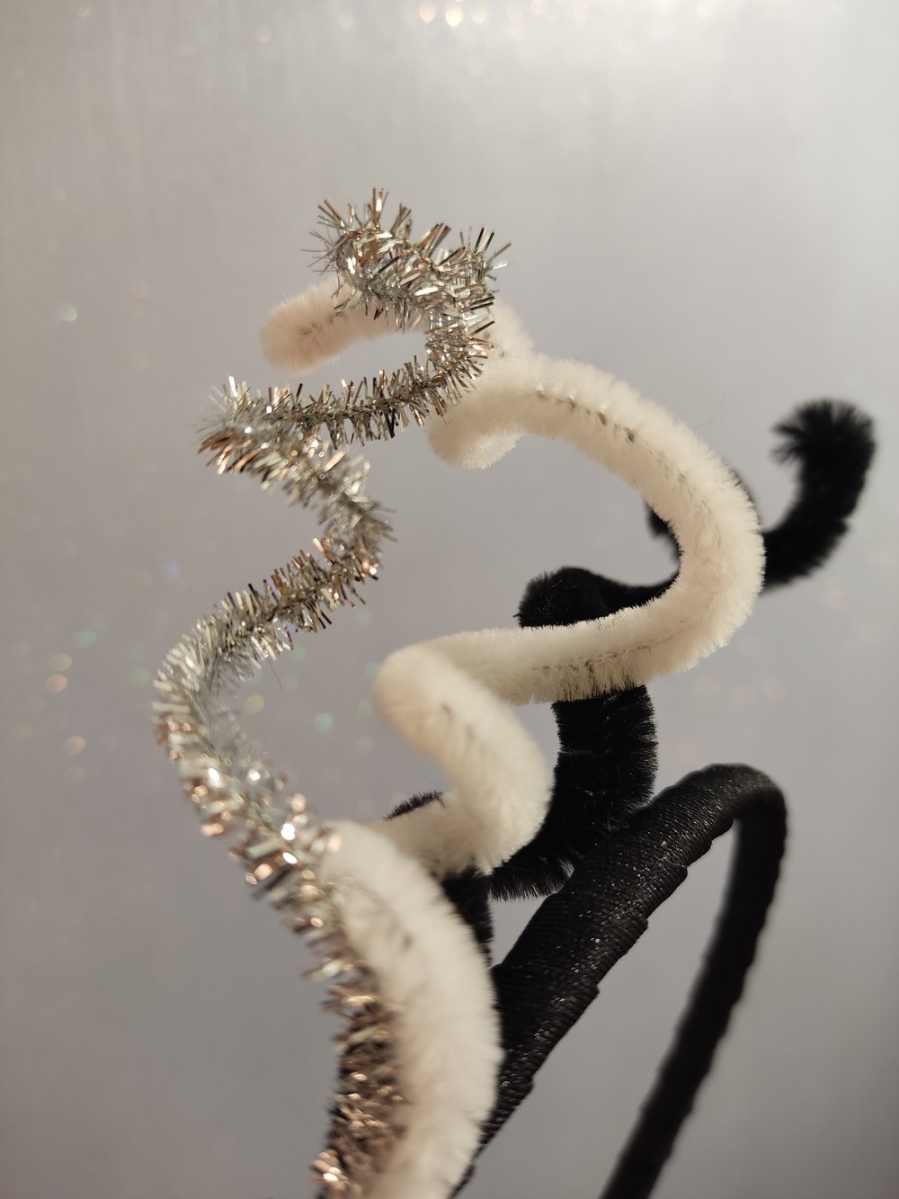 Image of Cerchietto brioso bianco/nero/argento