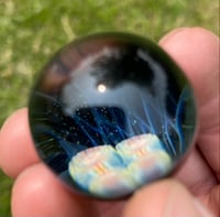 Image of Rainbow murrine with blue zanfirico backed in galaxy black 