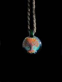 Image 1 of Psychedelic tree pendant backed with green x.