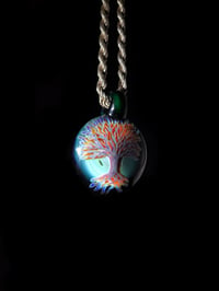 Image 3 of Psychedelic tree pendant backed with green x.