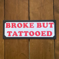 BROKE BUT TATTOOED (red text)