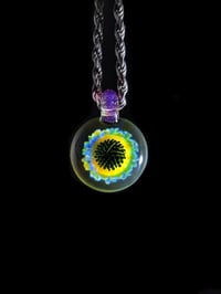 Image 3 of UV reactive psychedelic flower pendant..