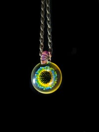 Image 4 of UV reactive psychedelic flower pendant..