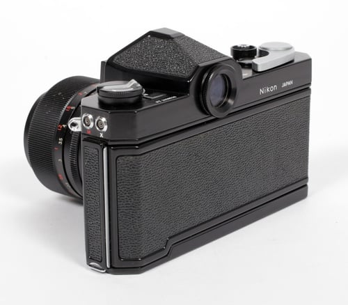 Image of Nikon Black Nikkormat FTn 35mm SLR film camera with 35mm and 135mm lenses #538