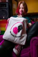 YOUR HEART IS A MUSCLE THE SIZE OF YOUR FIST Tote bag (Natural, with black and pink print)