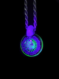 Image 4 of UV reactive psychedelic flower pendant with sacred Geometry dichro image center.