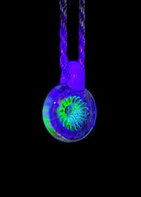 Image 5 of UV reactive psychedelic flower pendant with sacred Geometry dichro image center.