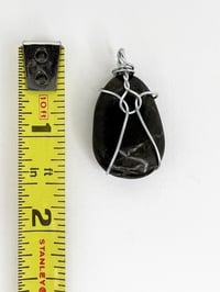 Image 4 of Wire Wrapped Round Flat Stone