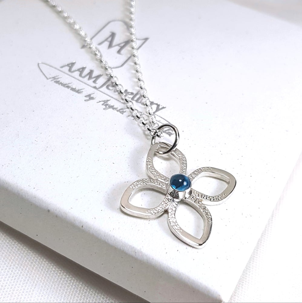 Image of Sterling Silver Flower Necklace, Blue Topaz Pendant, November Birthstone