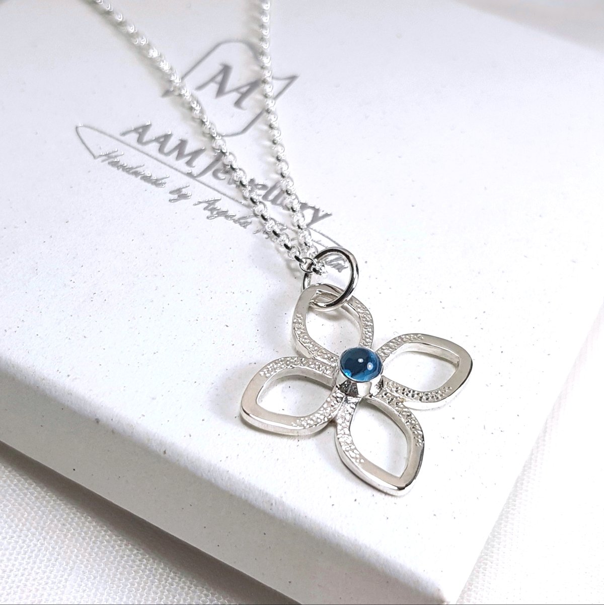 Image of Sterling Silver Flower Necklace, Blue Topaz Pendant, November Birthstone