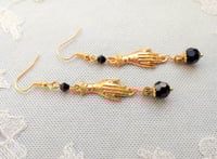 Image 3 of Victorian golden hand charm long earrings handmade with black faceted glass beads