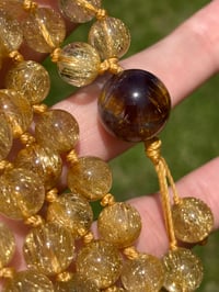 Image 3 of Gold Rutile 108 Bead Gemstone Mala with Cacoxenite in Amethyst Guru Bead, Gold Rutilated Quartz Mala