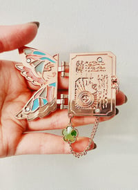 Image 1 of ffxiv scholar's codex enamel brooch