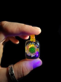 Image 1 of UV reactive square psychedelic flower pendant. 