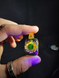 Image 2 of UV reactive square psychedelic flower pendant. 