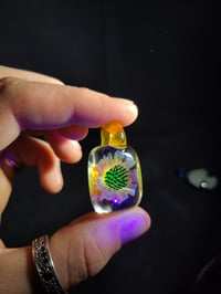 Image 3 of UV reactive square psychedelic flower pendant. 