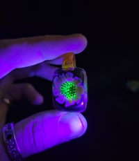 Image 4 of UV reactive square psychedelic flower pendant. 