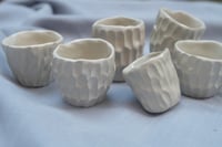 Image 2 of Little carved mugs.