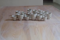 Image 1 of Little carved mugs.