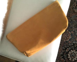 Image of golden wheat leather spring frame clutch