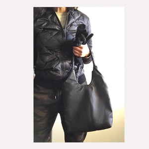 Image of black leather hobo with braided straps