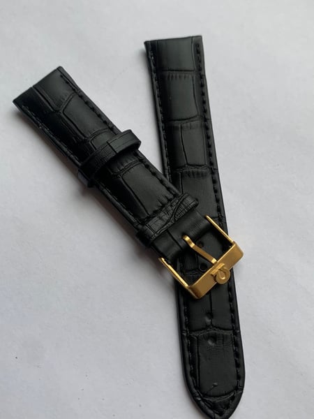 Image of genuine omega BLACK leather strap,vintage used clean yellow gold plated buckle attached 20mm.