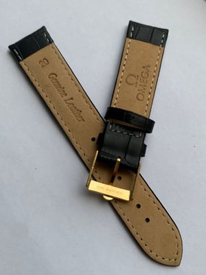 Image of genuine omega BLACK leather strap,vintage used clean yellow gold plated buckle attached 20mm.