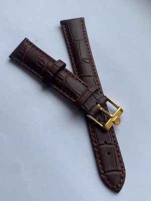 Image of genuine omega brown leather strap,vintage used clean yellow gold plated buckle attached 20mm.