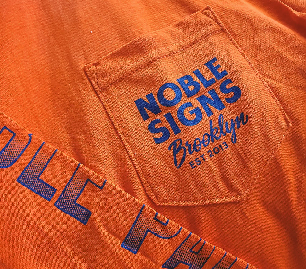 Noble Signs Official “Shop” Long Sleeve (Orange)