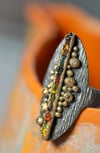 'into light' - recycled silver and gold ring with raw and faceted sapphires