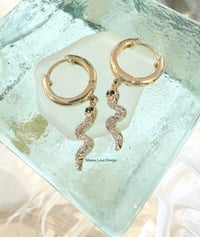 Image 1 of 14k solid gold diamond & blue sapphire dangling snake earrings 