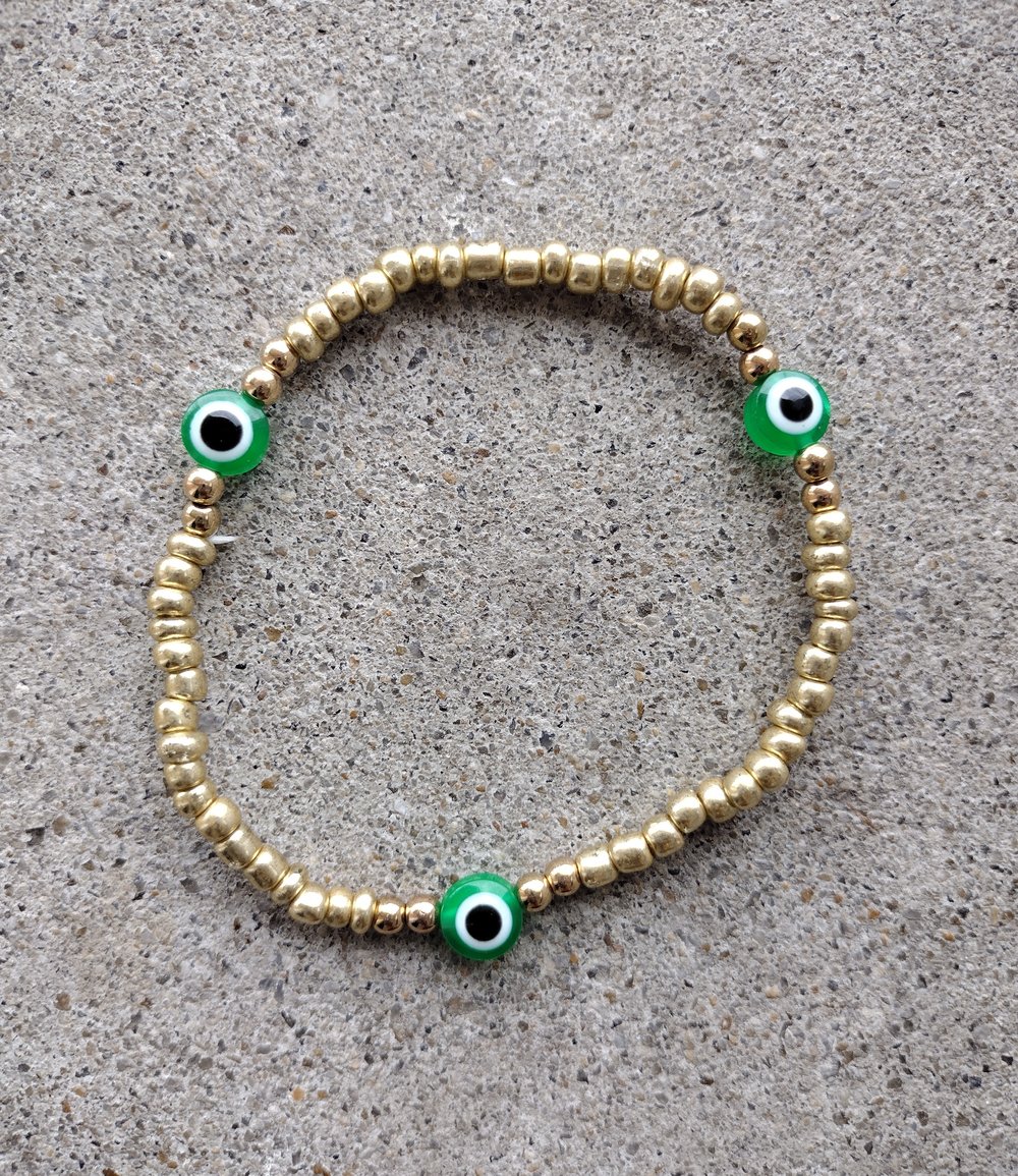 Image of Gold + green evil eye anklet 