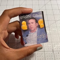 Image 1 of Nicolas Cage vs. 11 Words Mini Zine
