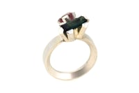 Image 5 of A contemporary ring featuring green and watermelon Tourmalines in a silver claw settings