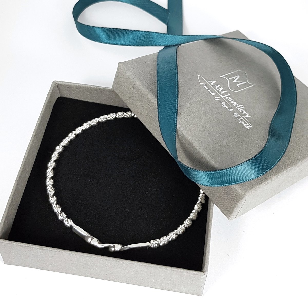 Image of Sterling Silver Twisted Bangle, Solid Silver Bracelet, Sustainable Jewellery, UK Hallmark