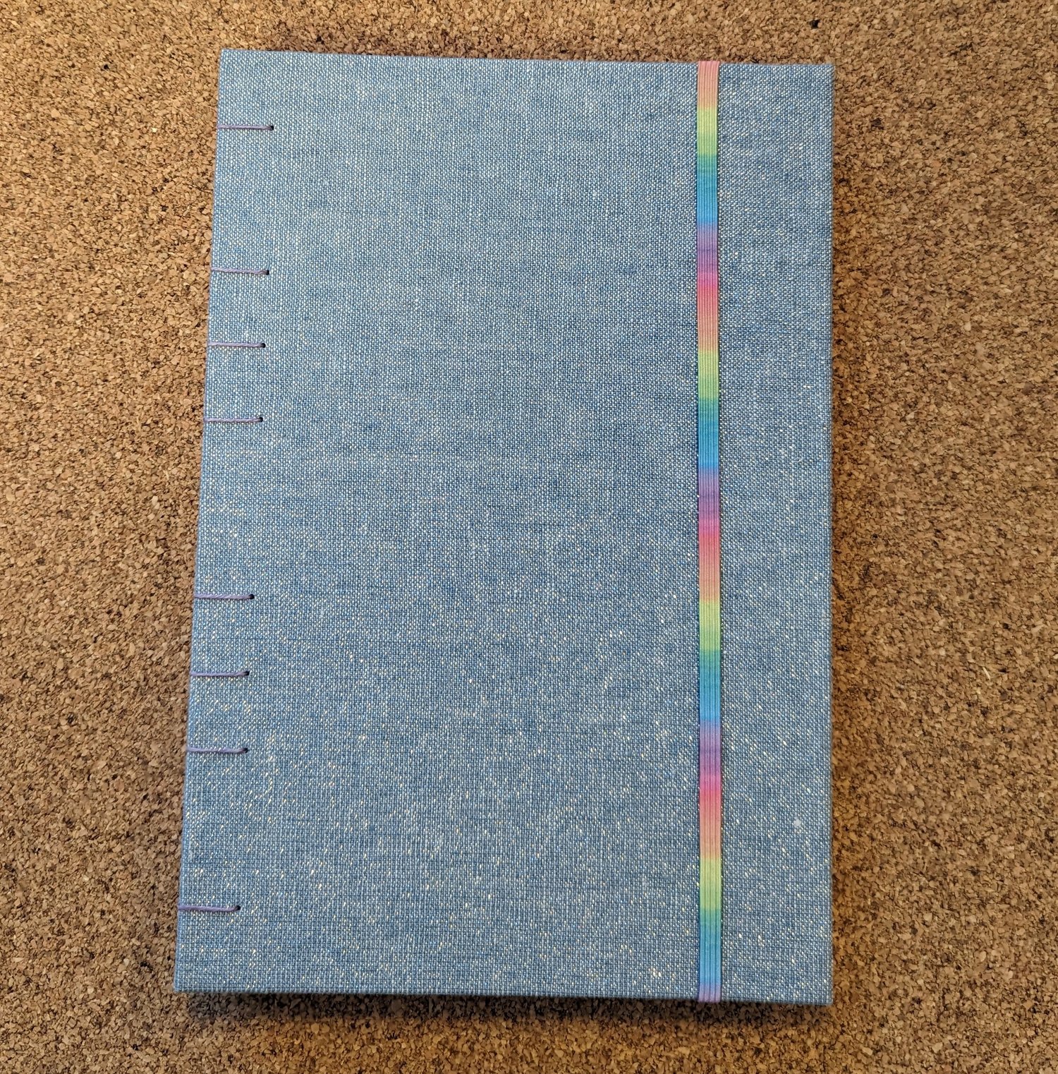 Image of Medium Blue and Silver Sketchbook with Pale Rainbow Elastic
