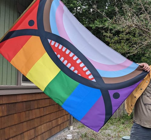 Image of Progress Pride Orca Face Flag