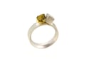A contemporary ring featuring rose cut yellow diamond in a 18ct gold claw setting with silver cube