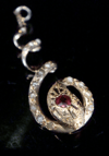 EDWARDIAN 9CT NATURAL RUBY AND PEARL SNAKE PENDANT