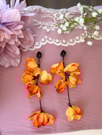 Image 4 of Oversized Orange Flower Dangles (BLACK)