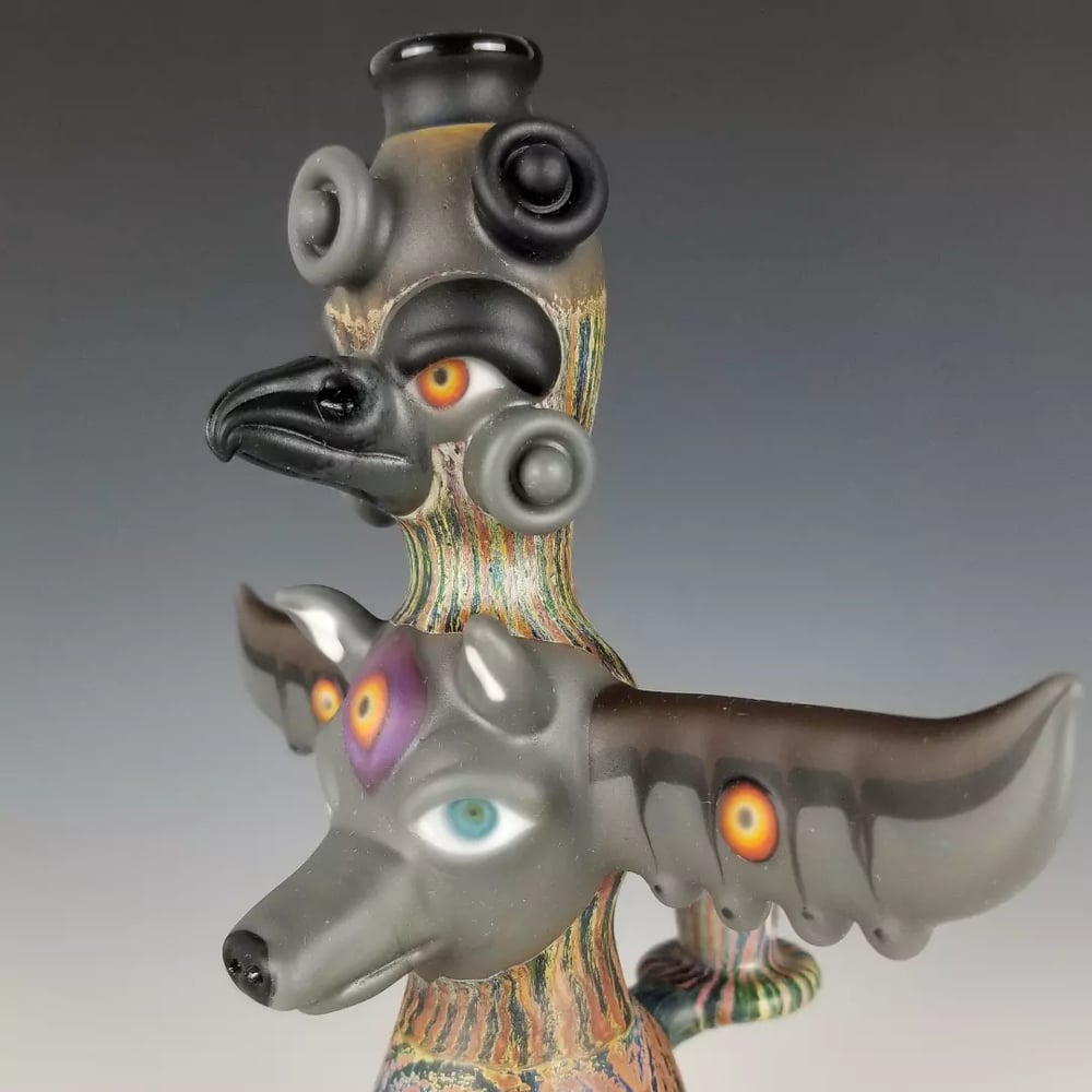 Image of Double Totem Pole with Bird and Wolf 