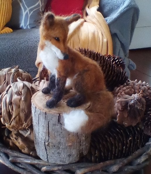 Image of small 6" red fox on wood