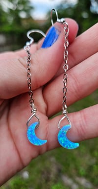 Image 2 of Blue opal crescent moon earrings. 