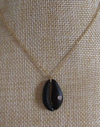 Image 1 of Meghan Markle Duchess of Sussex Inspired Black Sea Shell Cowrie Cauri Cypraea Pendant Charm Necklace