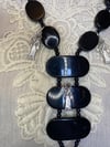 Upcycled Black Necklace With Skull and Mini Santa Muerte Charms by Ugly Shyla 